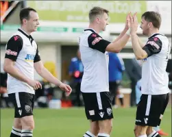  ??  ?? ALL SMILES: Hereford celebrate another of Mills’ goals