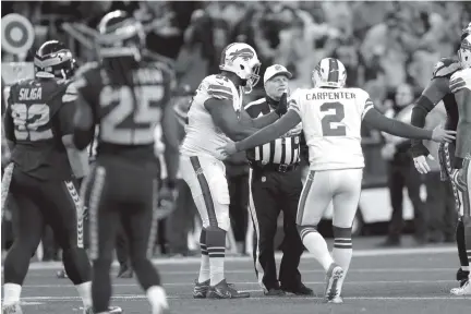  ?? THE ASSOCIATED PRESS ?? Buffalo Bills kicker Dan Carpenter (2) complains to referee Walt Anderson about being hit by Richard Sherman late in the first half of Monday night’s game against the Seattle Seahawks. Sherman spent last week criticizin­g what he believed were incorrect...