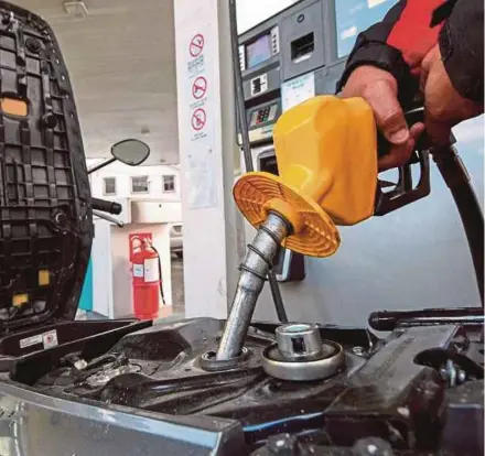  ?? FILE PIC ?? Car and motorcycle owners of certain engine capacities are eligible for fuel subsidies of 30 sen per litre, capped monthly at 100 litres for a car and 40 litres for a motorcycle.