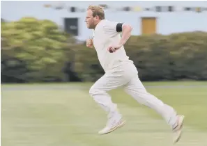  ??  ?? Tom Watson charges in to bowl for 2019 Beckett League champions Filey