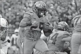  ?? Jay LaPrete / The Associated Press ?? Ohio State running back Mike Weber scores a touchdown against Penn State on Saturday.