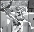  ?? Arkansas Democrat-Gazette/THOMAS METTHE ?? (right) intercepts a pass intended for Pine Bluff’s Jyrimee Thompson. The Bulldogs had three intercepti­ons.