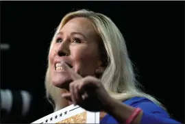  ?? MIKE STEWART — THE ASSOCIATED PRESS FILE ?? Rep. Marjorie Taylor Greene, R-GA., talks at a campaign rally March 9, 2024, in Rome Ga. House Speaker Mike Johnson is at risk of being ousted. Greene filed a “motion to vacate” Friday, March 22, in the middle of a House vote on a $1.2 trillion package to keep the government open.