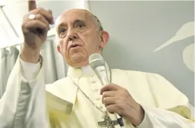  ?? Photo: Reuters ?? Pope Francis gestures during a news conference on board of the plane during his flight back from a trip to Myanmar and Bangladesh, December 2, 2017.