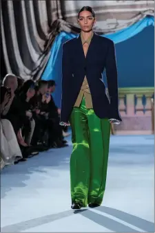  ?? MARY ALTAFFER — THE ASSOCIATED PRESS ?? Tory Burch’s lime green satin dress pant and blazer.
