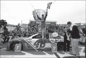  ?? The Associated Press ?? BACK ON TRACK: Driver Jimmie Johnson (48) celebrates after winning a NASCAR Monster Energy NASCAR Cup Series race Monday in Bristol, Tenn.