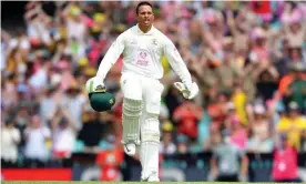  ?? Photograph: Dan Himbrechts/AAP ?? Usman Khawaja celebrates reaching his hundred on his return to the Australia team at the SCG.