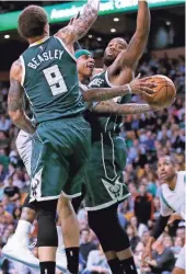  ?? ASSOCIATED PRESS ?? Celtics guard Isaiah Thomas tries to get past Bucks guard Michael Beasley on Wednesday in Boston. Beasley got extensive playing time.