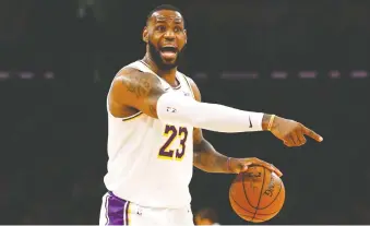  ?? KATHARINE LOTZE/GETTY IMAGES ?? Lebron James and many other NBA superstars seem to save their best efforts for the playoffs, writes Scott Stinson, and the league is suffering from a drop in attendance and TV ratings.