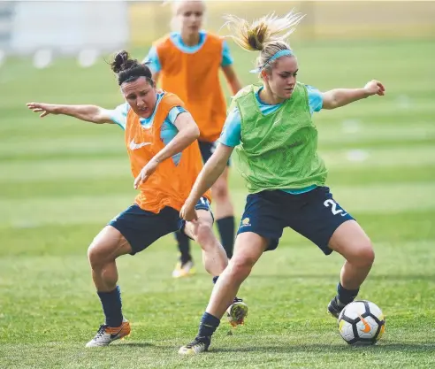  ?? Picture: AAP IMAGE ?? IN MINORITY: Australia-based Matildas Lisa De Vanna (left) and Ellie Carpenter challenge for the ball during a training session in Sydney on Tuesday. A national football team with an internatio­nal feel will play Brazil on Saturday in Penrith.