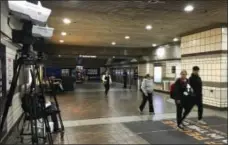  ?? DAVE SOTERO - LA METRO ?? Stand-off explosion detection units, left, are deployed in a corridor at The Metro in Los Angeles.