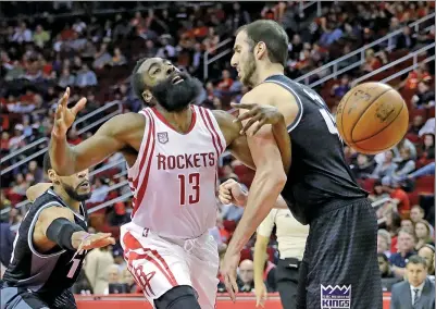  ?? AP ?? Houston Rockets’ James Harden is fouled by Sacramento Kings’ Kosta Koufos in the second half of Wednesday’s game in Houston.