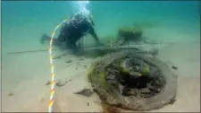  ?? Pic: Underwater Archeology Unit. ?? An underwater diver at one of the artefacts discovered.