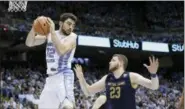  ?? ASSOCIATED PRESS FILE ?? North Carolina’s Luke Maye (32) grabs a rebound over Notre Dame’s Martinas Geben (23) during the second half in Chapel Hill, N.C.