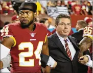  ?? GETTY IMAGES ?? Washington Redskins owner Daniel Snyder stands with cornerback Josh Norman during the national anthem before the game against the Raiders on Sunday night.