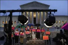  ?? PATRICK SEMANSKY — THE ASSOCIATED PRESS ?? Student debt relief advocates gather outside the Supreme Court on Capitol Hill in Washington on Monday. Arguments at the Supreme Court over President Joe Biden’s student debt cancellati­on left some borrowers feeling isolated as they heard such a personal subject reduced to cold legal language.