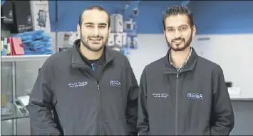  ??  ?? Mega Computers owner Fazli Ibrahim, left, and Hamilton East store technician Arminder Singh.