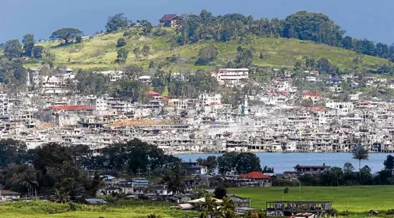  ?? —JEOFFREY MAITEM ?? SCAR OFWAR The government is preparing a rehabilita­tion plan for Marawi City after intense fighting between the military and Islamic State-inspired terrorists in the last four months left sections of the picturesqu­e lakeside capital of Lanao del Norte...