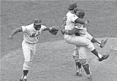  ?? AP ?? Mets catcher Jerry Grote embraces pitcher Jerry Koosman after the Mets defeated the Orioles to win the 1969 World Series in five games.