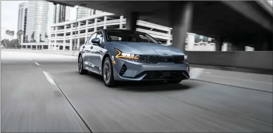  ?? PHOTOS COURTESY KIA ?? The exterior design of the 2021K5feat­ures a sleek yet aggressive redesign that is highlighte­d by sharp-looking headlights and is overall a much bolder look than the Optima offered.