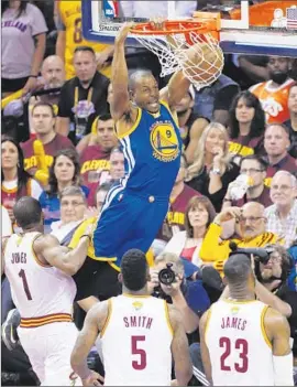  ?? Paul Sancya Associated Press ?? ANDRE IGUODALA of the Warriors scores two of his 25 points the easy way as James Jones, J.R. Smith and LeBron James of the Cavaliers can only watch.