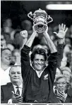  ?? FAIRFAX MEDIA ?? David Kirk lifts the William Webb Ellis cup in 1987.