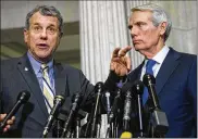  ?? DREW ANGERER/GETTY IMAGES ?? Sen. Sherrod Brown (left), D-Ohio, voted to convict President Trump. Sen. Rob Portman, R-Ohio, voted to acquit.