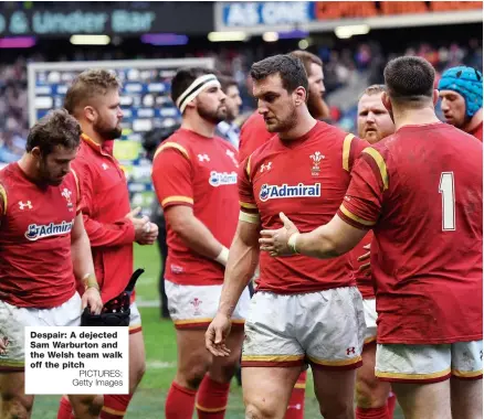  ?? PICTURES: Getty Images ?? Despair: A dejected Sam Warburton and the Welsh team walk off the pitch