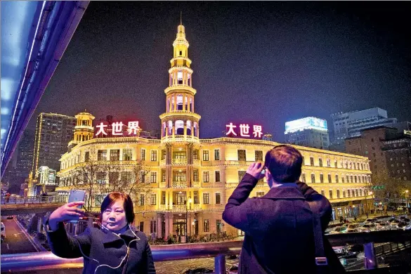  ??  ?? Comprising three four-story buildings and two wings, The Great World had for decades been a prominent landmark in Shanghai.