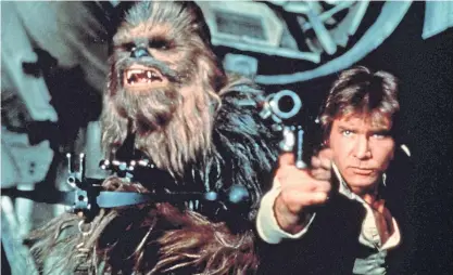  ?? ?? Harrison Ford as Han Solo and Peter Mayhew as Chewbacca in Star Wars Episode IV – A New Hope, 1977