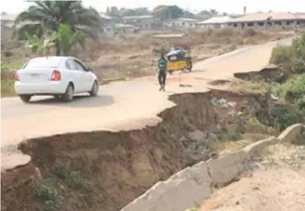  ??  ?? A road affected by erosion in South-west Nigeria