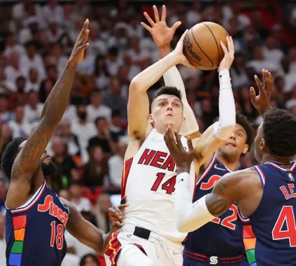  ?? Michael Reaves, Getty Images ?? Miami guard Tyler Herro (14) goes up for a al layup against the Philadelph­ia 76ers during the second half at FTX Arena on Monday in Miami.