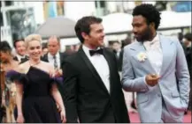  ?? PHOTO BY ARTHUR MOLA — INVISION — AP ?? Actors Emilia Clarke, from left, Alden Ehrenreich, and Donald Glover pose for photograph­ers upon arrival at the premiere of the film ‘Solo: A Star Wars Story’ at the 71st internatio­nal film festival, Cannes, southern France, Tuesday.