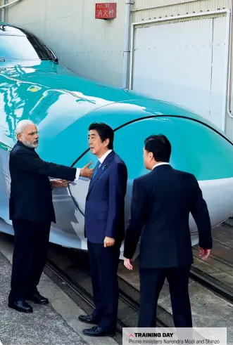  ??  ?? TRAINING DAY
Prime ministers Narendra Modi and Shinzo Abe at a Kawasaki Heavy Industries factory