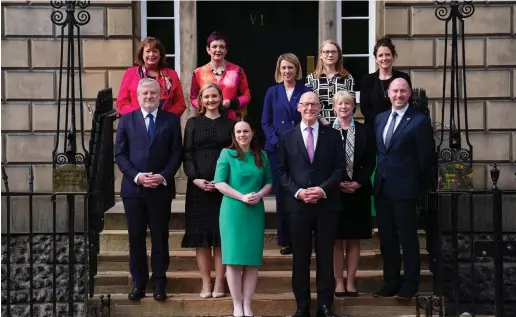  ?? ?? First Minister John Swinney pictured with members of his cabinet outside Bute House. Images: PA