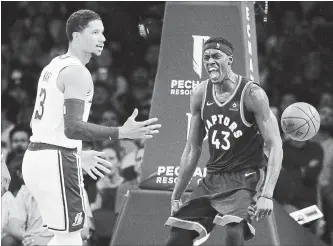  ?? MARCIO JOSE SANCHEZ THE ASSOCIATED PRESS ?? Toronto Raptors forward Pascal Siakam, right, celebrates after dunking next to Los Angeles Lakers’ Josh Hart at the Staples Center in Los Angeles on Sunday.