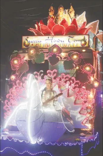  ?? (Terrence Thompson photo) ?? The Success Hindu Temple’s float depicting the Hindu goddess Saraswati on a swan, which is a symbol of spiritual perfection, during the Guyana Hindu Dharmic Sabha’s Grand Diwali Motorcade last evening.