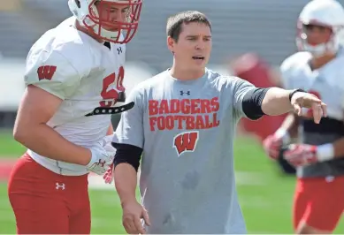  ?? MARK HOFFMAN / MILWAUKEE JOURNAL SENTINEL ?? Defensive coordinato­r Jim Leonhard is shown during Wisconsin's training camp practice in July at Camp Randall Stadium in Madison.