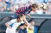  ?? — USA Today Sports ?? United States’ Chris Pontius (7) heads the ball over Nicaragua’s Bismarck Veliz (17) in the Gold Cup match.