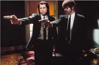  ?? Linda R. Chen Miramax Films ?? HITMEN Vincent and Jules (John Travolta, left, Samuel L. Jackson) in Tarantino’s “Pulp Fiction.”