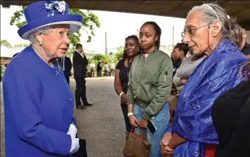  ??  ?? Compassion: She meets residents including Rhianna Levi, 17, second from right