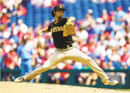  ?? CHRIS SZAGOLA AP ?? Padres starting pitcher Yu Darvish throws a pitch during the second inning Thursday against the Phillies. He went seven scoreless innings and improved to 4-1.