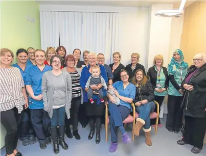  ?? Picture: Steven Brown. ?? Joan Taylor, centre, with friends and colleagues at Victoria Hospital.