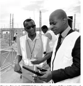  ?? CONTRIBUTE­D ?? Director Principal of REDTRAC Major George Benson (left) and Ministry of National Security Project Manager Thaddeti Tulloch discuss expansion works being undertaken on the building at Twickenham, St Catherine, during a recent site visit.