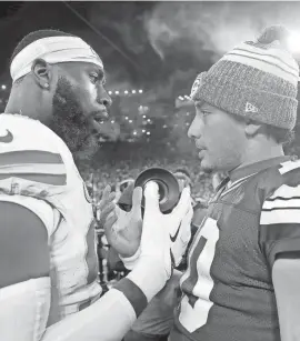  ?? WM. GLASHEEN/USA TODAY NETWORK-WISCONSIN ?? Packers quarterbac­k Jordan Love talks with Chiefs defensive end Charles Omenihu following a game on Dec. 3.