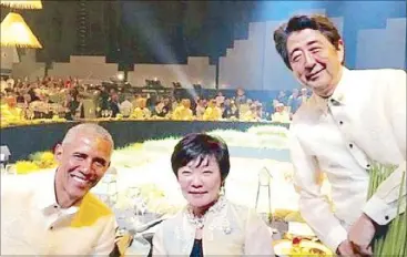  ??  ?? Photo from his Facebook account shows Japanese Prime Minister Shinzo Abe with his wife, Akie, posing for a photograph with US President Barack Obama.