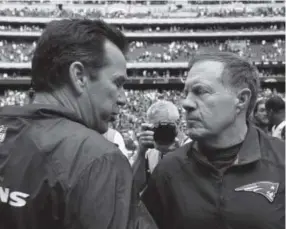  ??  ?? Gary Kubiak was coaching the Texans when he shook hands with Patriots coach Bill Belichick after a game during the 2013 season. Scott Halleran, Getty Images