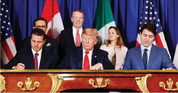  ?? PABLO MARTINEZ MONSIVAIS/THE ASSOCIATED PRESS ?? From left, Mexico’s President Enrique Peña Nieto, U.S. President Donald Trump and Prime Minister Justin Trudeau participat­e in the USMCA signing ceremony on Friday. Trump is viewed as using his threat of terminatin­g NAFTA as leverage to force the Democratic Congress to approve its replacemen­t, the USMCA.