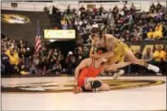  ?? PHOTO COURTESY OF MISSOURI ATHLETICS ?? Missouri’s Jaydin Eierman wrestles Oklahoma State’s Kaid Brock in the 141-pound match of Saturday’s dual at the Hearnes Center in Columbia, Mo. Eierman won the match by fall.