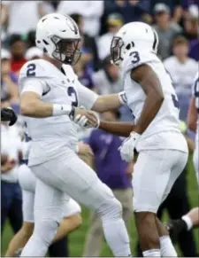  ?? NAM Y. HUH — THE ASSOCIATED PRESS ?? Penn State’s Tommy Stevens, left, celebrates with DeAndre Tompkins after scoring a touchdown during first half of Saturday’s game against Northweste­rn. the